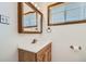 Bathroom features a vanity with cabinet and window at 283 Garland Dr, Northglenn, CO 80233