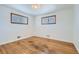 Bedroom features hardwood floors, neutral paint, and natural light at 283 Garland Dr, Northglenn, CO 80233