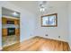 Cozy dining area featuring hardwood floors, a ceiling fan, and a view into the kitchen at 283 Garland Dr, Northglenn, CO 80233