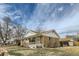 Well-kept single-Gathering home featuring a brick exterior, cozy front porch, and neat landscaping at 283 Garland Dr, Northglenn, CO 80233