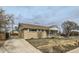 Charming brick home with a well-maintained lawn and classic design, perfect for a cozy living experience at 283 Garland Dr, Northglenn, CO 80233