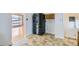 Kitchen features stainless steel refrigerator and tile flooring at 283 Garland Dr, Northglenn, CO 80233