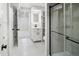 Modern basement area with stylish vanity and tiled shower behind glass doors at 1660 S Kingston Way, Aurora, CO 80012