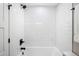 Modern bathroom featuring white subway tile in the shower, sleek fixtures, and a clean design at 1660 S Kingston Way, Aurora, CO 80012