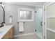 Bathroom featuring a marble countertop vanity, modern fixtures, and glass-enclosed shower at 1660 S Kingston Way, Aurora, CO 80012