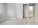 Bedroom featuring carpet, baseboards, and a closet with sliding doors at 1660 S Kingston Way, Aurora, CO 80012