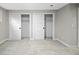Bedroom with carpet, closets with sliding doors, and baseboards at 1660 S Kingston Way, Aurora, CO 80012