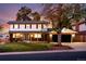 Charming two-story home featuring a well-manicured lawn and inviting covered porch at 1660 S Kingston Way, Aurora, CO 80012