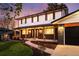 Charming two-story home featuring a well-manicured lawn and inviting covered porch at 1660 S Kingston Way, Aurora, CO 80012