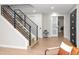 Hallway with staircase, featuring neutral walls and modern doors at 1660 S Kingston Way, Aurora, CO 80012