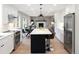 Modern kitchen leading into the dining and living areas, perfect for entertaining and Gathering gatherings at 1660 S Kingston Way, Aurora, CO 80012