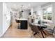 Spacious kitchen with stainless steel appliances, adjacent dining area, and backyard views through large window at 1660 S Kingston Way, Aurora, CO 80012