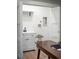 A clean laundry room with a sink, storage and washer/dryer hookups at 1660 S Kingston Way, Aurora, CO 80012