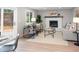 Cozy living room features a fireplace, neutral colors, and sliding doors to access the backyard patio at 1660 S Kingston Way, Aurora, CO 80012