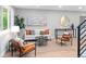 Bright and airy living room with neutral tones and modern furniture at 1660 S Kingston Way, Aurora, CO 80012