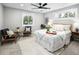Bright main bedroom with large windows, ceiling fan, carpet and stylish furniture and decor at 1660 S Kingston Way, Aurora, CO 80012