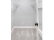 A clean walk-in closet with carpet, baseboards, and simple white wire shelving at 1660 S Kingston Way, Aurora, CO 80012