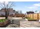 Fenced backyard with a hammock, gravel and garden boxes at 85 N Grant St # 30, Denver, CO 80203