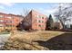 Expansive backyard with well-maintained lawn, mature trees, and an outdoor seating area, ideal for relaxation at 85 N Grant St # 30, Denver, CO 80203