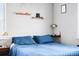 This bedrom features a comfortable bed, hardwood floors, and stylish bedside decor at 85 N Grant St # 30, Denver, CO 80203