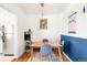Cozy dining area features a wooden table with blue chairs, and stylish light fixture at 85 N Grant St # 30, Denver, CO 80203