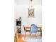 Inviting dining area features a wooden table with chairs, light fixture, and stylish decor at 85 N Grant St # 30, Denver, CO 80203