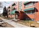 Beautiful exterior shot of the brick apartment building with well-maintained landscaping at 85 N Grant St # 30, Denver, CO 80203