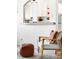 Stylish living area with a comfortable chair and ottoman, adjacent to the kitchen at 85 N Grant St # 30, Denver, CO 80203