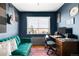 Modern office with large window, recording equipment, and vintage hardwood floors at 85 N Grant St # 30, Denver, CO 80203