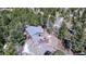 Mountain home featuring a spacious deck for outdoor enjoyment and surrounded by mature trees for privacy at 10439 Christopher Dr, Conifer, CO 80433