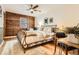 Inviting bedroom featuring unique wooden decor, ample lighting, and a comfortable atmosphere at 10439 Christopher Dr, Conifer, CO 80433