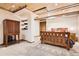 Bedroom with wood ceiling and wood furnishings, including a cabinet, and neutral carpeting at 10439 Christopher Dr, Conifer, CO 80433