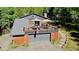 Charming log cabin with an oversized deck above the garage, nestled amongst the trees at 10439 Christopher Dr, Conifer, CO 80433