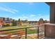 Balcony view overlooking a park and residential area at 6618 E Lowry Blvd # 210, Denver, CO 80230