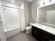 Modern bathroom with a bathtub, shower, and updated vanity at 6618 E Lowry Blvd # 210, Denver, CO 80230