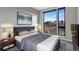 Spacious bedroom with large windows and a view at 6618 E Lowry Blvd # 210, Denver, CO 80230