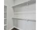Large walk-in closet with double hanging rods and shelving at 6618 E Lowry Blvd # 210, Denver, CO 80230
