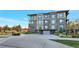 Modern building exterior with landscaped grounds and parking at 6618 E Lowry Blvd # 210, Denver, CO 80230