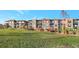 Modern condominium building with landscaped grounds at 6618 E Lowry Blvd # 210, Denver, CO 80230