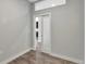 Hallway with a pocket door leading to another room at 6618 E Lowry Blvd # 210, Denver, CO 80230