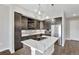 Modern kitchen with stainless steel appliances and an island at 6618 E Lowry Blvd # 210, Denver, CO 80230
