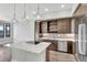 Modern kitchen with stainless steel appliances and an island at 6618 E Lowry Blvd # 210, Denver, CO 80230