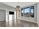 Bright and spacious living room with hardwood floors and large windows at 6618 E Lowry Blvd # 210, Denver, CO 80230