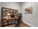 Home office with built-in shelving and a comfortable chair at 6618 E Lowry Blvd # 210, Denver, CO 80230