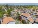 Aerial view of residential neighborhood showcasing well-maintained homes with mature trees in the community at 5250 Cody St, Arvada, CO 80002