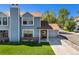 Attractive two-story home with a well-maintained lawn and an attached one car garage at 5250 Cody St, Arvada, CO 80002