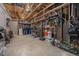 A spacious garage with exposed ceiling, storage, and room for projects at 5250 Cody St, Arvada, CO 80002