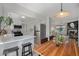 Bright kitchen with white cabinets, stainless steel appliances, and eat-in breakfast bar at 5250 Cody St, Arvada, CO 80002