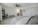 Spacious main bedroom with a ceiling fan and a ensuite bathroom featuring a modern vanity and mirror at 5250 Cody St, Arvada, CO 80002