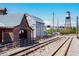 Arvada train tracks near the station, historical buildings, and a vintage water tower on a clear day at 5250 Cody St, Arvada, CO 80002